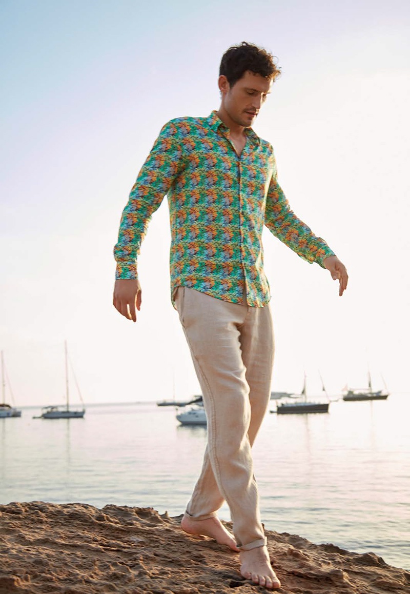Embracing resort style, Sam Webb rocks a Vilebrequin jungle print shirt $220 with linen pants $260.