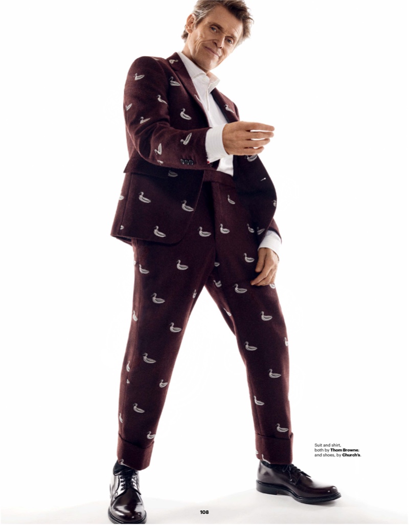 Rocking an all-over print, Willem Dafoe sports a Thom Browne shirt and suit with Church's shoes.