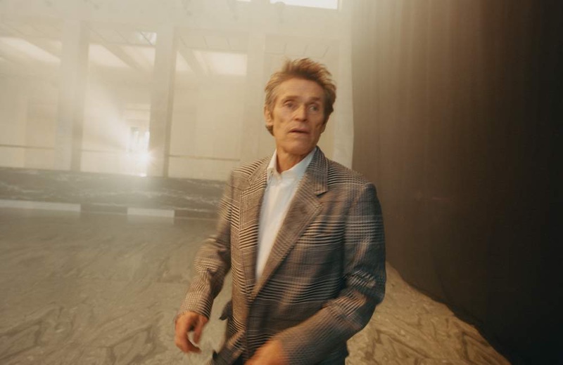 Willem Dafoe dons a Dunhill coat with a Maximilian Mogg tuxedo shirt.