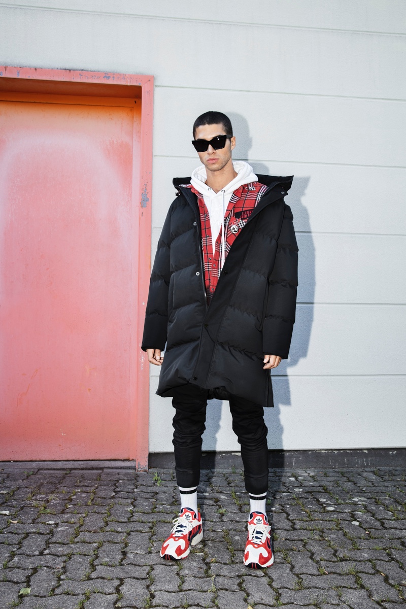 A cool vision, Daniel Angulo models an Autarak jacket with G-Star pants and a shirt and hoodie by Diesel. 