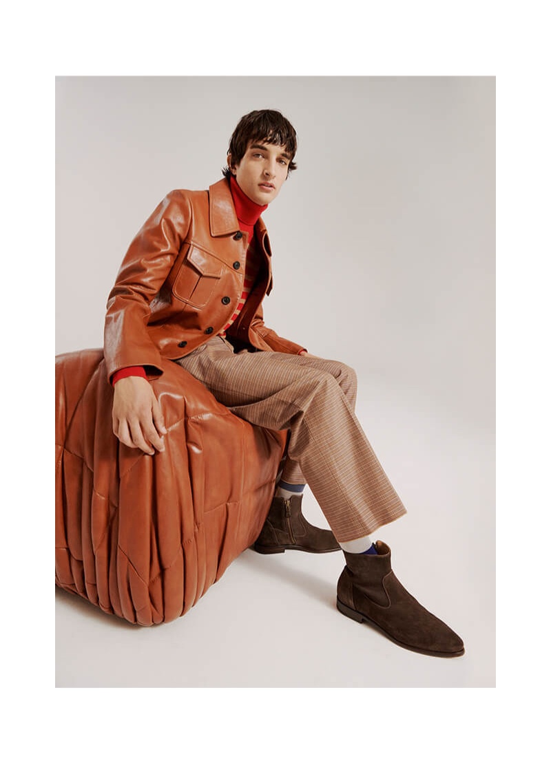 Pablo Fernandez sports a Maison Margiela leather jacket with checked Marni trousers.