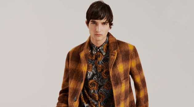 Pablo Fernandez Dons Vintage-Inspired '70s Style for YOOX Connecting with YOOX, Pablo Fernandez dons a checked coat by AMI with a Versus Versace shirt and Acne Studios pants.