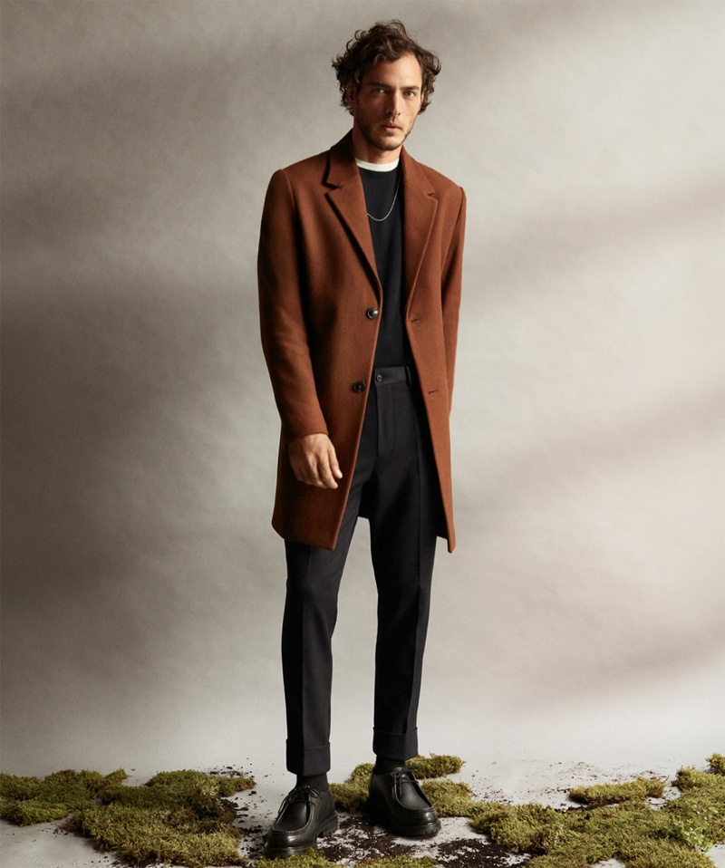 Making a case for autumnal hues, Pierre-Benoit Talbourdet wears a brown coat by Zara.