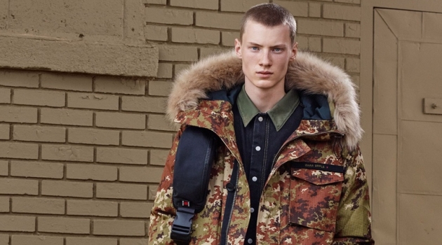Zara is Camo Obsessed for Fall '19 SRPLS Collection Braien Vaiksaar sports a digital camouflage print parka with denim from Zara SRPLS' fall-winter 2019 collection.