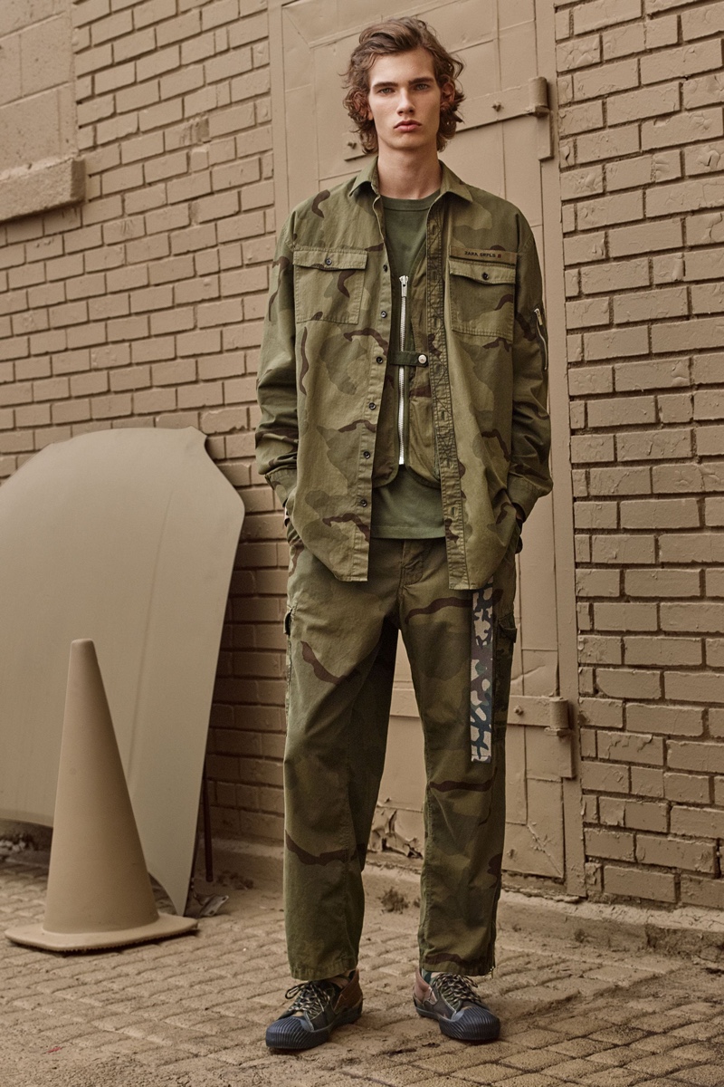 Lukas Gomann rocks a camouflage print shirt and cargo pants from Zara SRPLS' fall-winter 2019 collection.