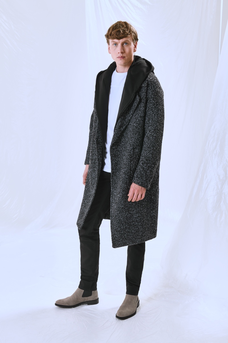 Sid Ellisdon dons a long coat from Antony Morato's "Open Mind" capsule collection.