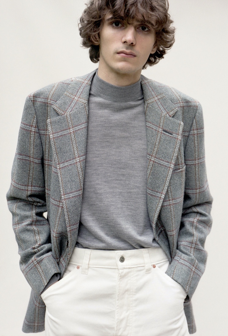 Massimo Colonna wears a Camoshita jacket with a John Smedley mock neck sweater and Drake's trousers. 