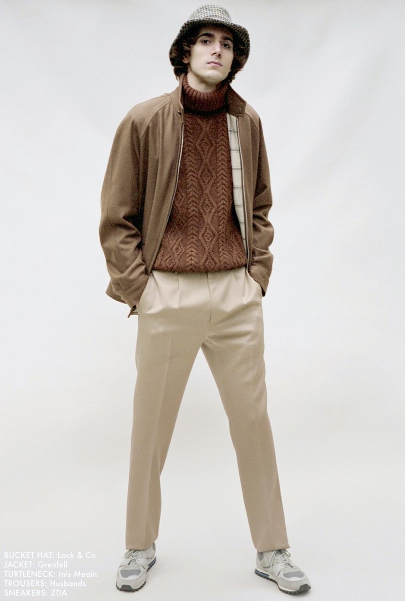 Front and center, Massimo Colonna wears a Lock & Co. bucket hat, Grenfell jacket, Inis Meain turtleneck, Husbands trousers, and ZDA sneakers.