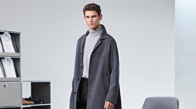 Arthur Gosse Sports Key BOSS Outerwear Arthur Gosse dons an oversized gray coat by BOSS.