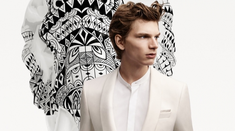 A sharp vision in a white evening look, Erik van GIls fronts the BOSS x Meissen holiday campaign.