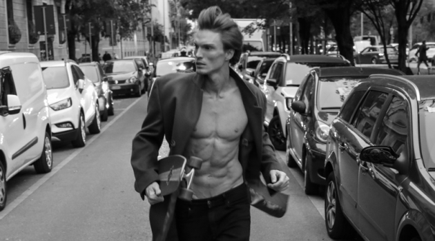 Bruno Novodvorski Hits the Streets of Milan for Shoot On the move, Bruno Novodvorski is captured in a black and white image.
