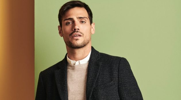 Richard Deiss Brushes Up on Wardrobe Essentials with Burton Donning a coat, sweater, shirt, and pants, Richard Deiss sports an essential look from Burton.