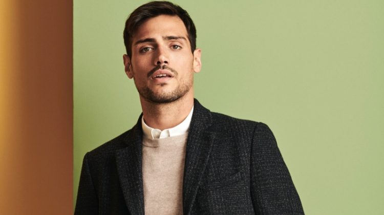 Donning a coat, sweater, shirt, and pants, Richard Deiss sports an essential look from Burton.