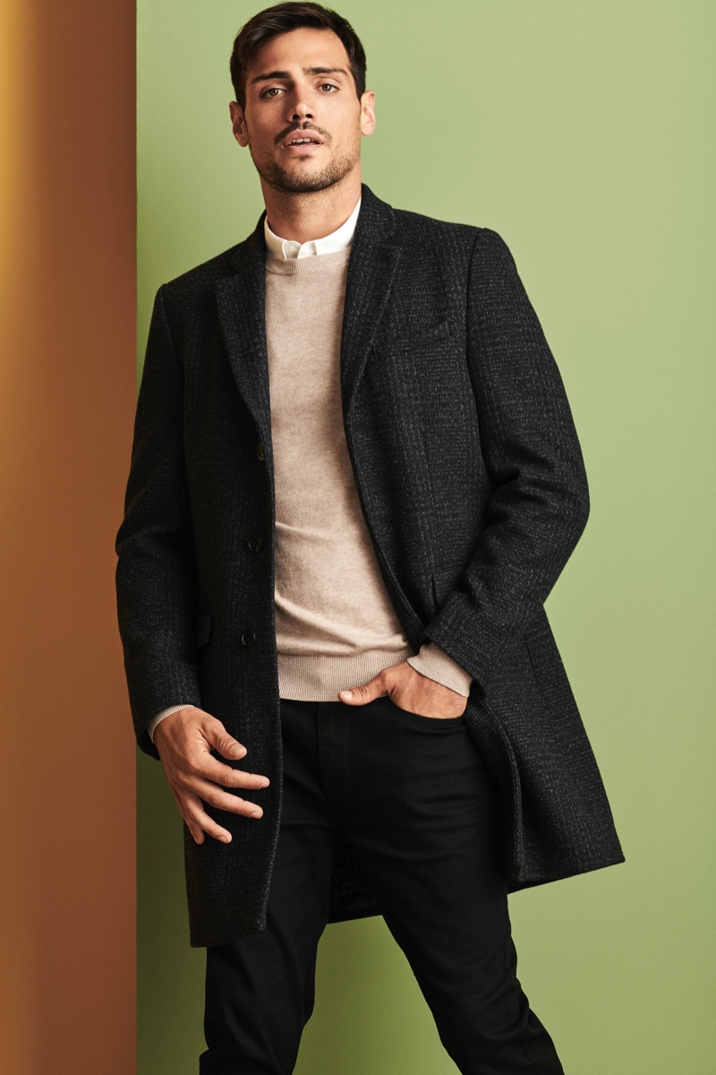 Donning a coat, sweater, shirt, and pants, Richard Deiss sports an essential look from Burton.