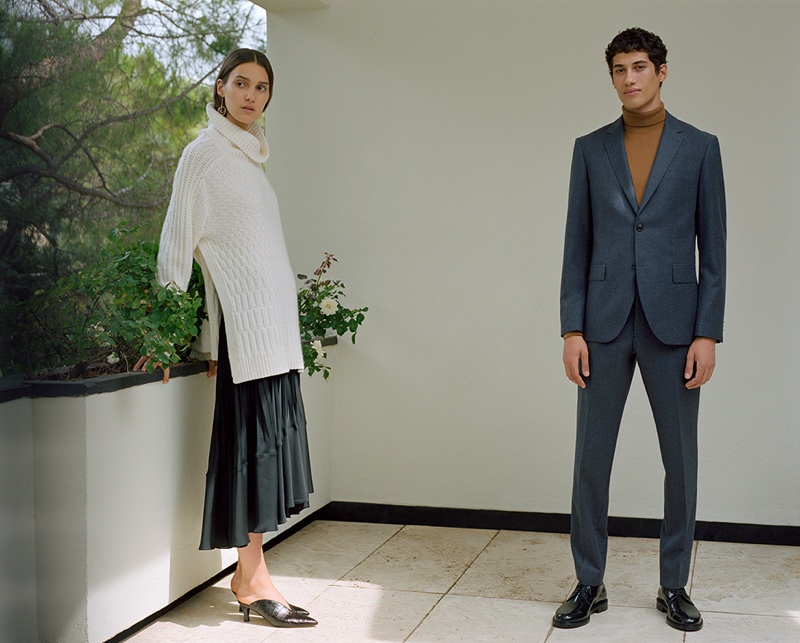 Dressed to impress, Malik Al Jerrari wears Club Monaco's Grant wool flannel blazer and trousers with a turtleneck sweater.