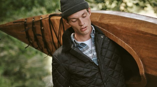 Rocky Harwood Goes Rugged in Barbour for East Dane Model Rocky Harwood dons a Barbour plaid shirt and quilted jacket with a POLO Ralph Lauren pocket tee.
