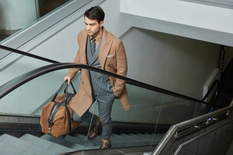 Taking on the role of the traveling man, Aleksandar Rusić stars in Eleventy's fall-winter 2019 campaign.