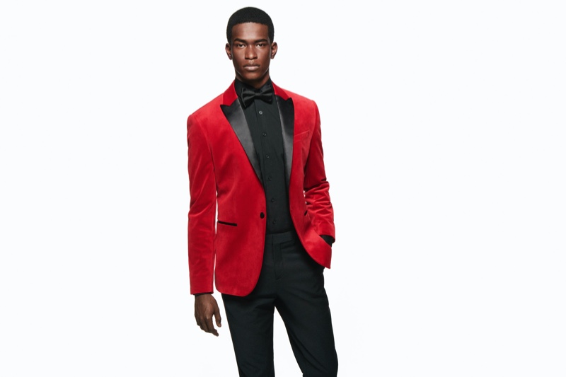 A dapper vision in a red and black tuxedo jacket, Salomon Diaz appears in Express' holiday 2019 campaign.