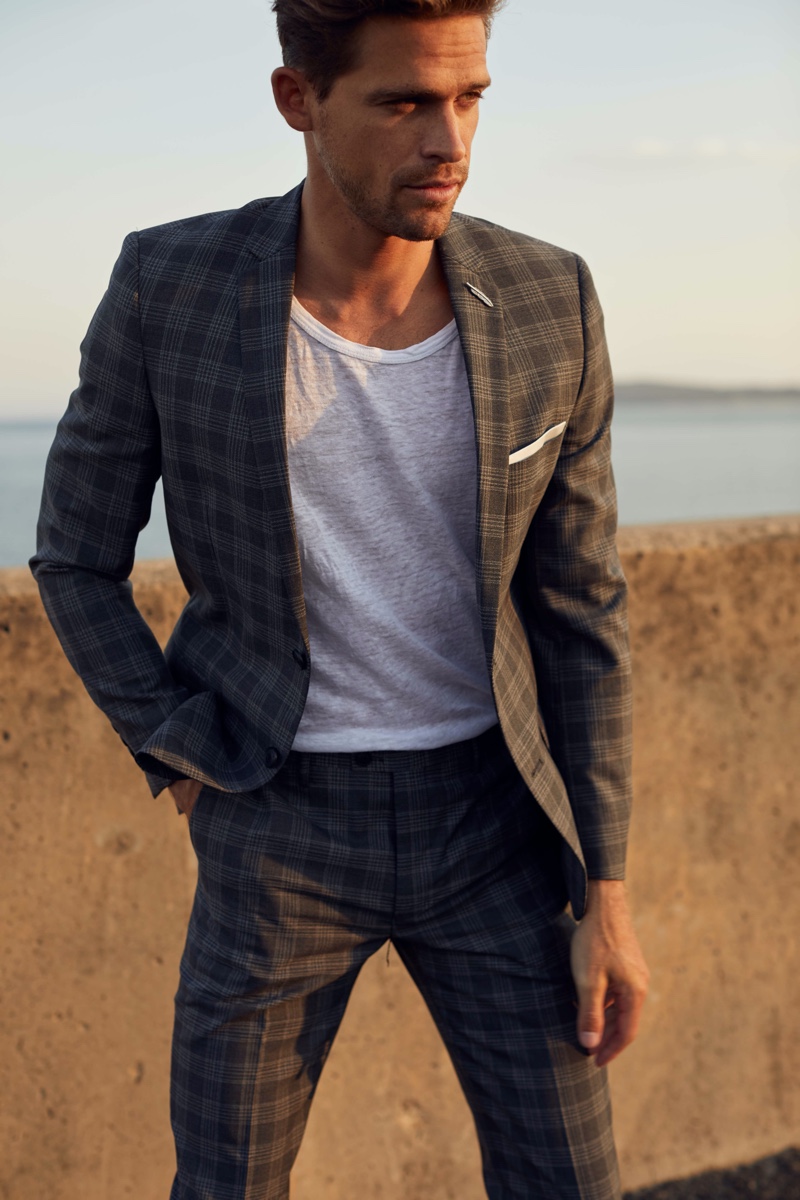 Broed wears checked gray suit Jack London and tee Venroy.