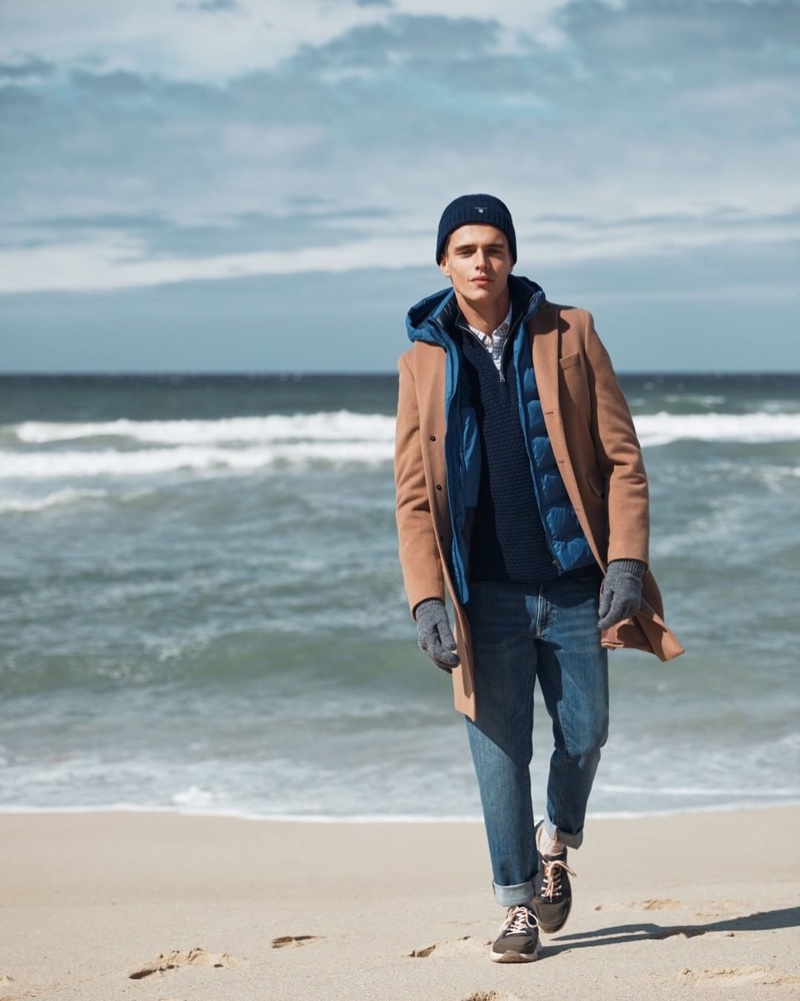 Taking to the beach, Jordy Baan appears in GANT's fall-winter 2019 campaign.