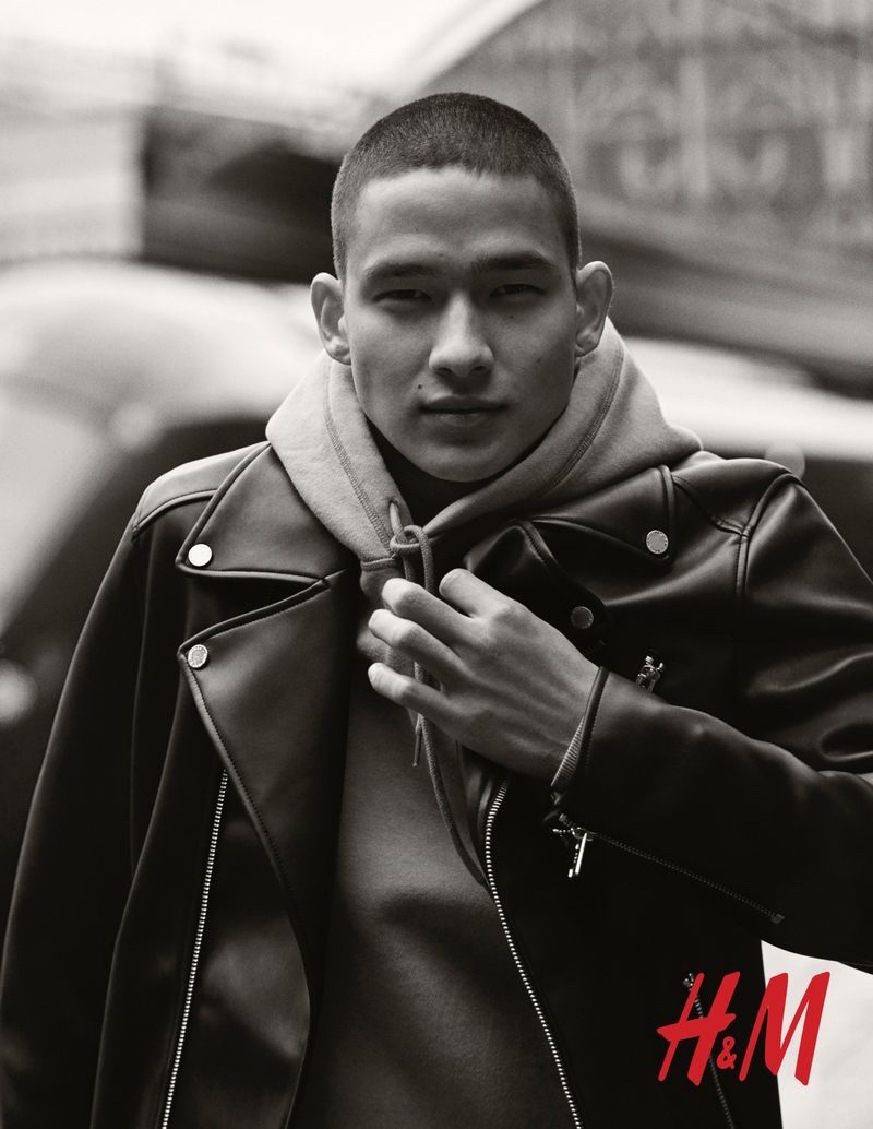 Tommy Vanden Meerssche rocks a leather biker jacket with a hoodie by H&M.