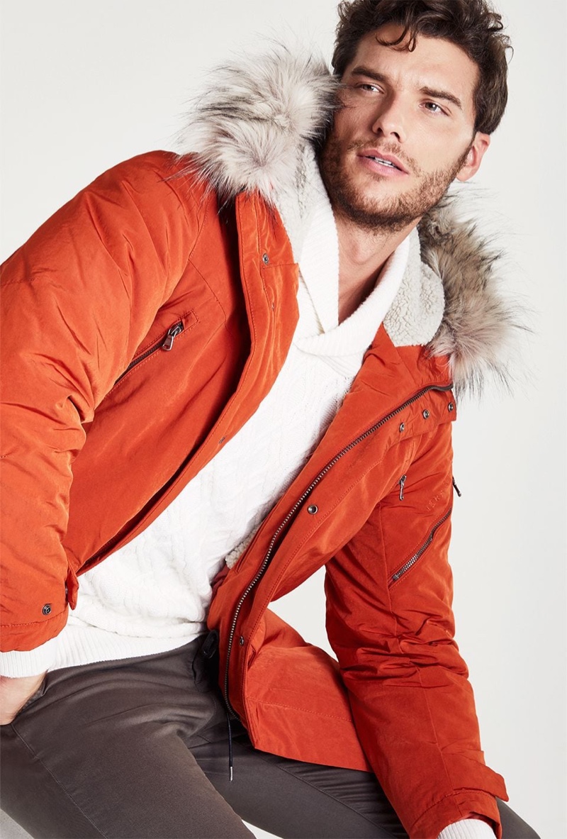 Making a case for color, Aurelien Muller wears an orange parka from IKKS.