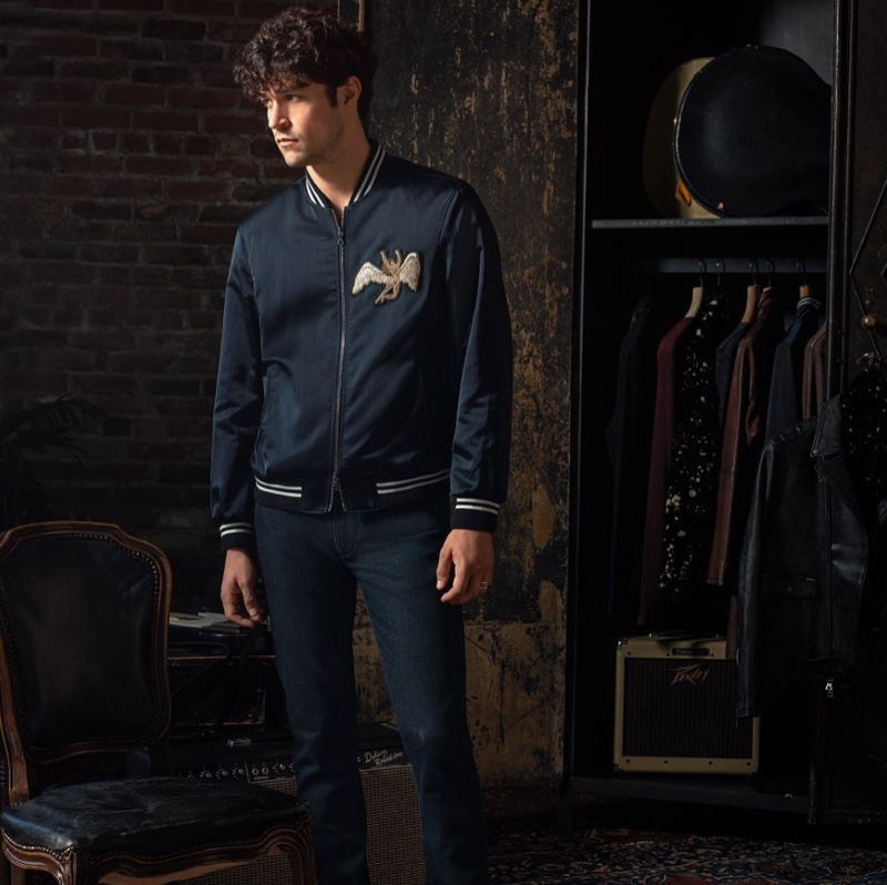 Front and center, Miles McMillan rocks a tour jacket $1,398 from the John Varvatos x Led Zeppelin capsule collection.