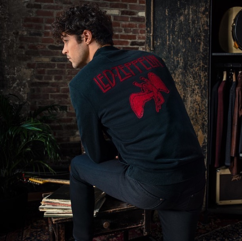 Embracing vintage-inspired style, Miles McMillan models a track jacket $298 from the John Varvatos x Led Zeppelin capsule collection.