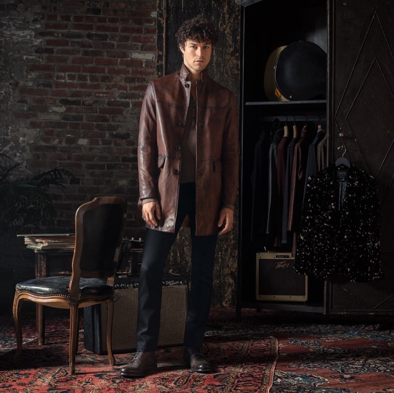 Model Miles McMillan dons a brown leather coat $2,698 from the John Varvatos x Led Zeppelin capsule collection.