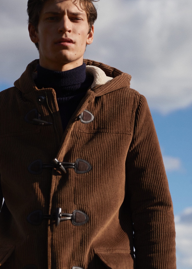 Sporting a brown corduroy duffle coat, Justin Eric Martin connects with Mango for its latest outing.