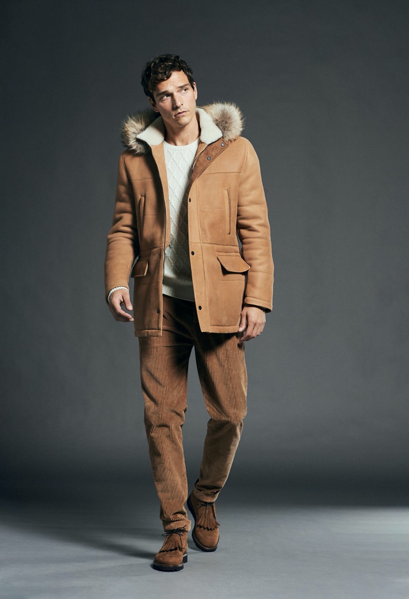 Making a case for rich brown hues, Alexandre Cunha dons a shearling coat and corduroy pants from Kiton.