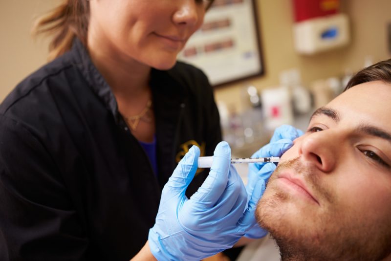 Man Receiving Cosmetic Treatment Needle