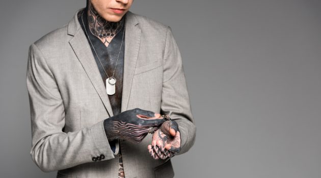 Interesting Facts You Didn't Know About Silver Man with Tattoos Wearing Jewelry