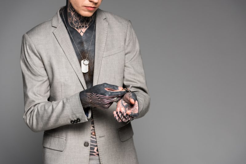 Man with Tattoos Wearing Jewelry
