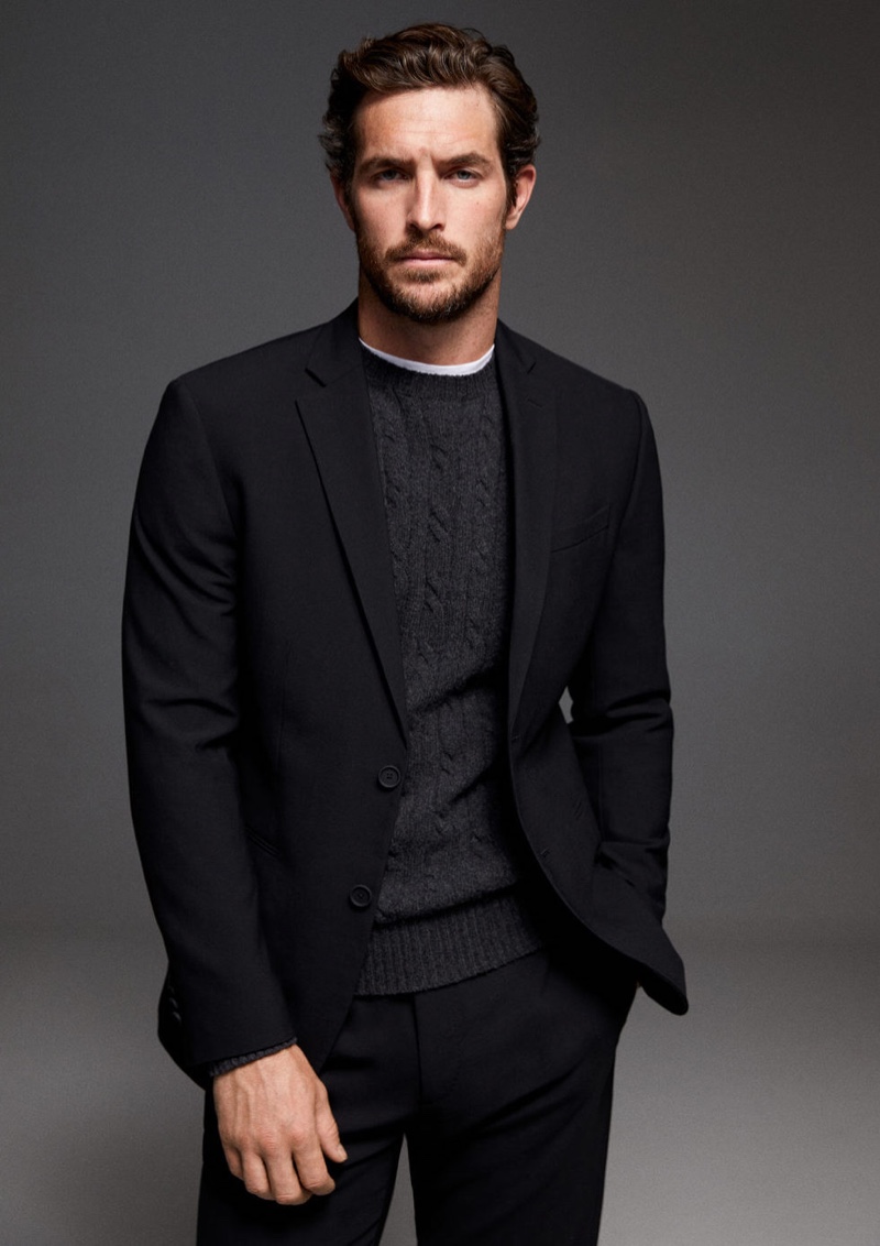 Making a case for black and gray, Justice Joslin wears a Mango suit with a cable-knit sweater.