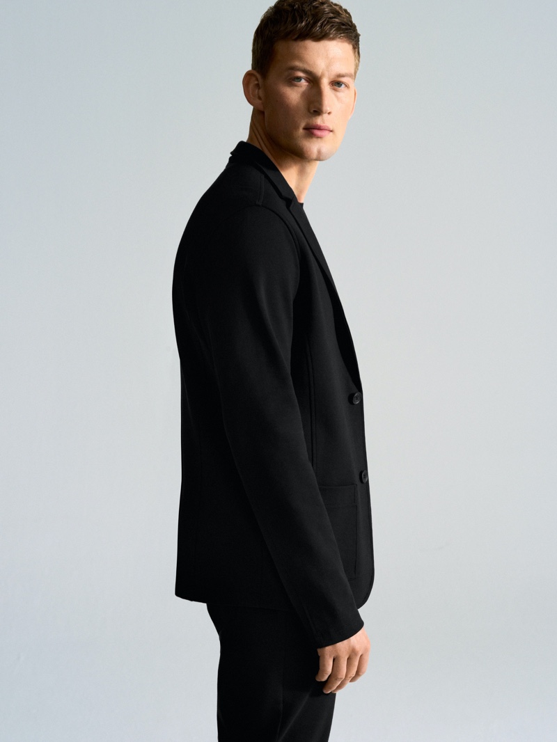 A sleek vision, Bastian Thiery dons a suit jacket by Marc O'Polo.