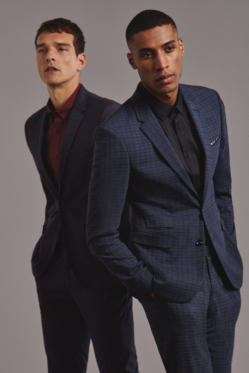 Models Alexandre Cunha and Joshua Payne don fall-winter 2019 suiting from Marks & Spencer.