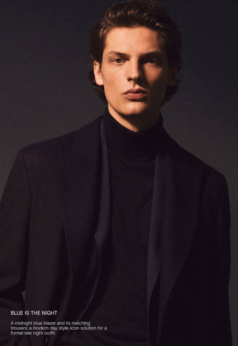 Embracing midnight blue, Valentin Caron dons a sartorial look by Massimo Dutti.