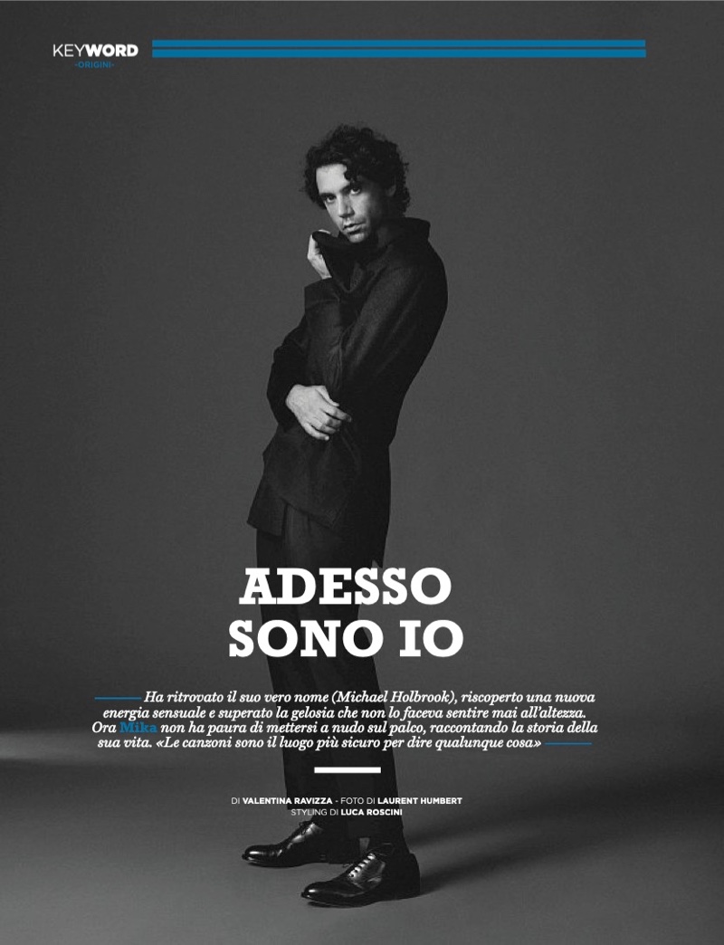 Taking to the studio, Mika wears an Emporio Armani coat with Giorgio Armani pants.