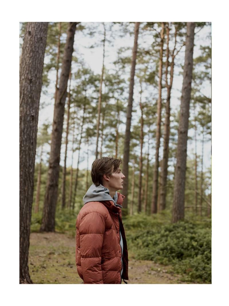 Taking to the woods, Finnlay Davis sports a Stone Island garment-dyed quilted crinkle nylon down jacket.