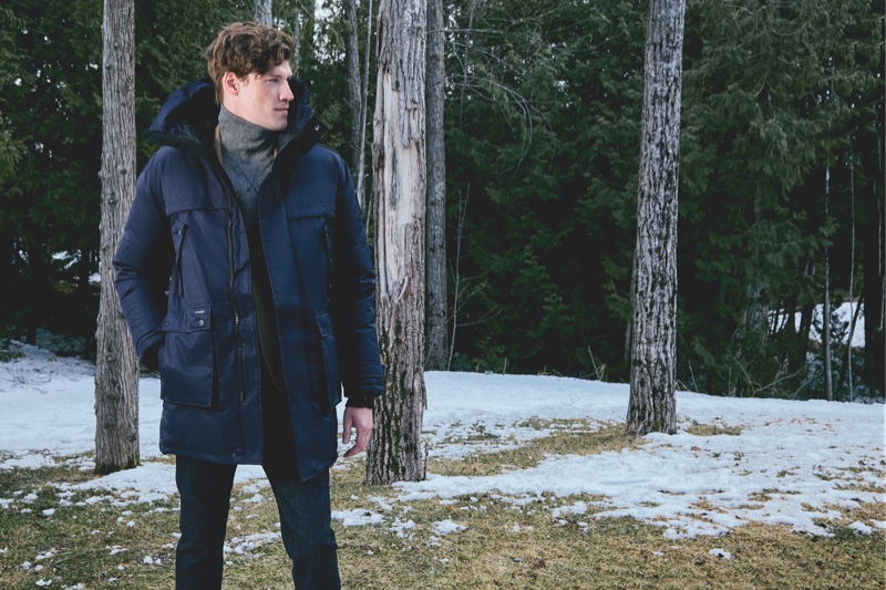 Stepping outdoors, Alex Loomans sports a blue jacket from Nobis' fall-winter 2019 collection.