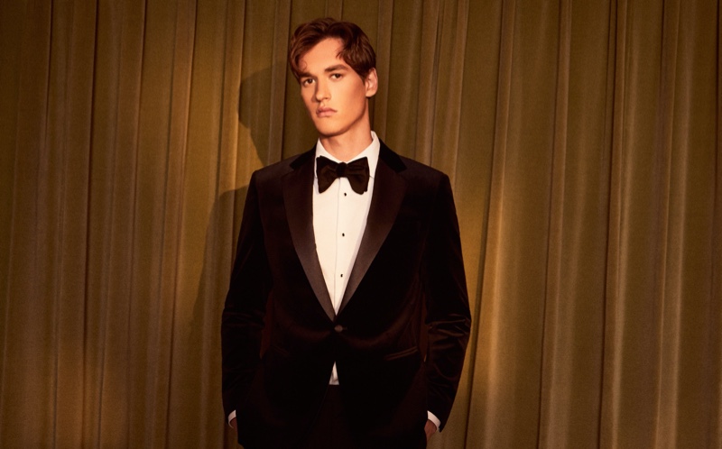 Ready for a formal affair, Jegor Venned wears a velvet dinner jacket, white shirt, black bow-tie, and trousers by Reiss.