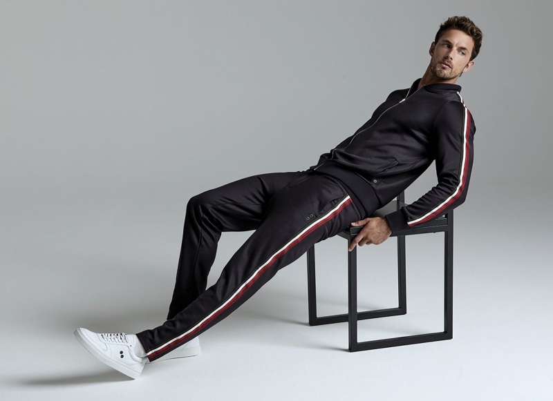 A sporty vision, Christian Hogue models a tracksuit by Ron Dorff.