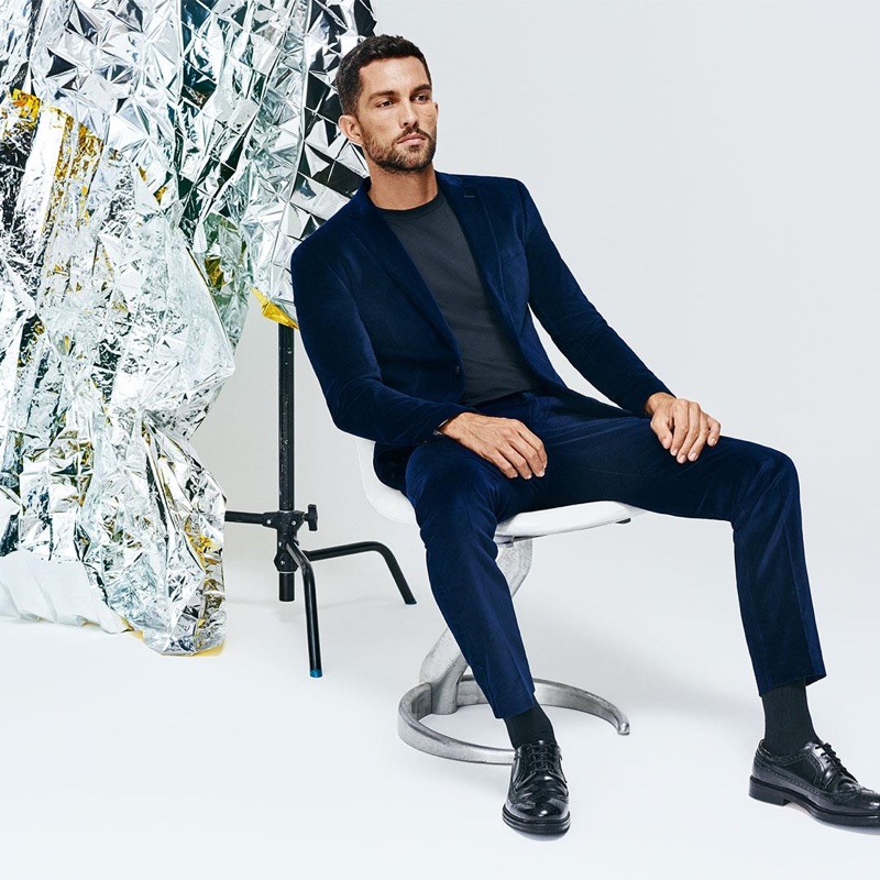 Front and center, Tobias Sorensen sports a blue velvet suit from Selected Homme.