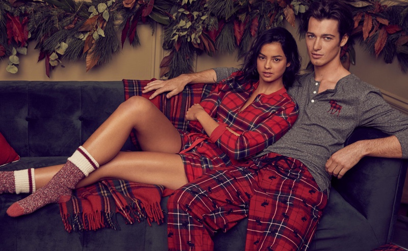 Nora Mejdouli and Robbie Beeser don pajamas for Simons' holiday 2019 campaign.