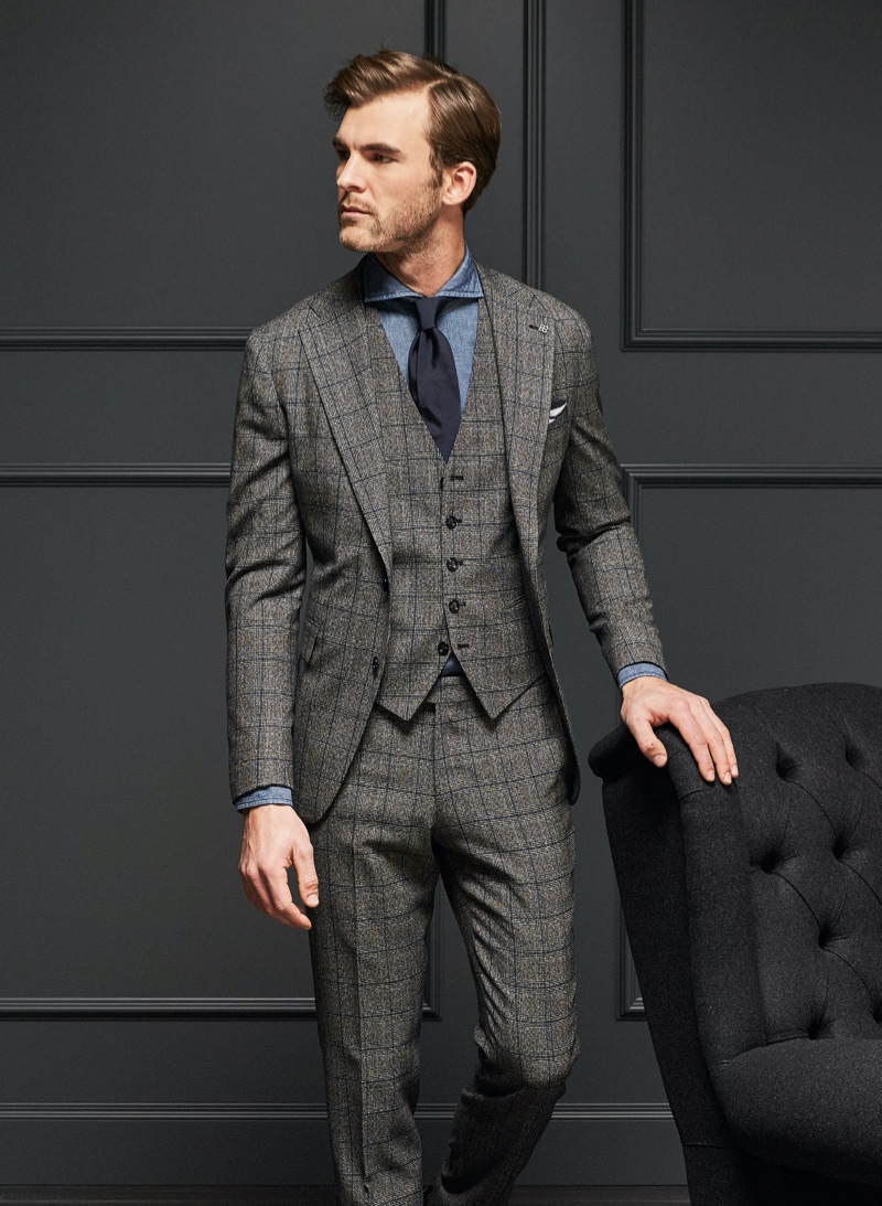 Donning a three-piece suit, Patrick Kafka dons Tagliatore.