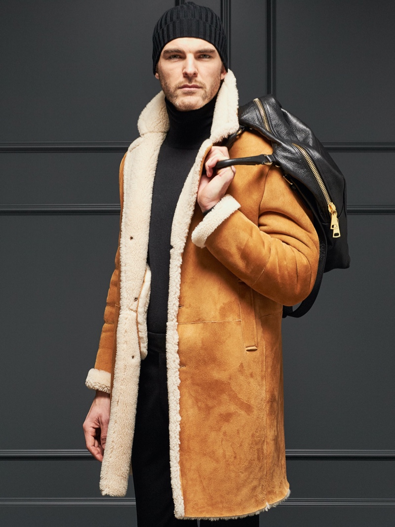Model Patrick Kafka rocks a shearling coat from Tagliatore's fall-winter 2019 collection.