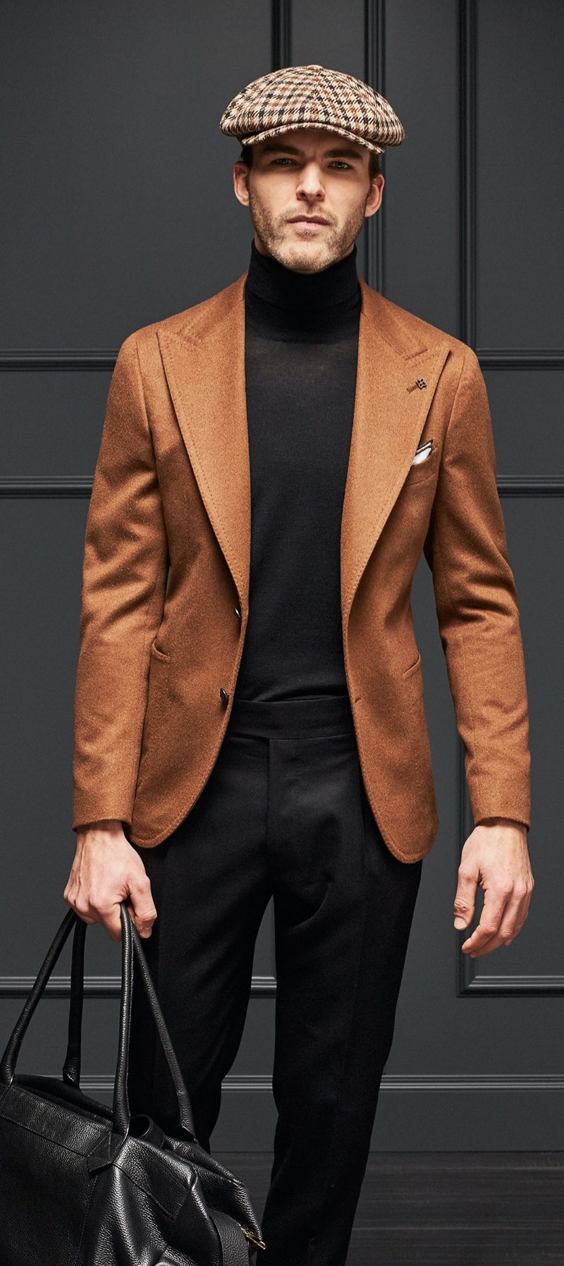 Embracing brown and black, Patrick Kafka wears fall-winter 2019 styles from Tagliatore.