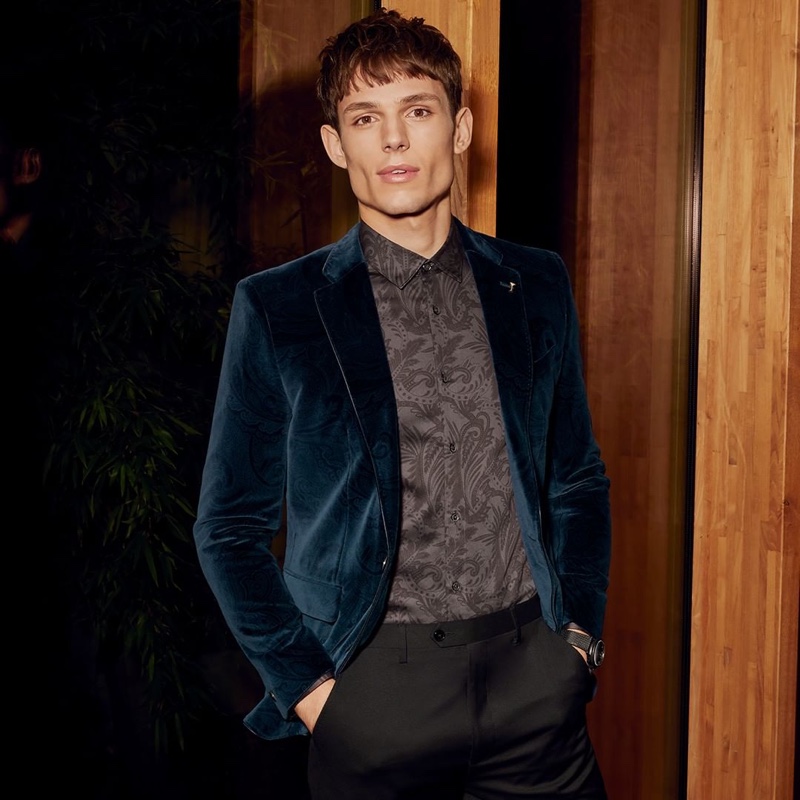 Adrian Sotiris dons a regal Ted Baker velvet jacket $785 in dark blue.