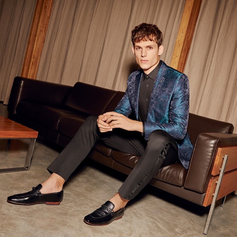 Connecting with Ted Baker, Adrian Sotiris sports the brand's teal jacquard blazer $785.